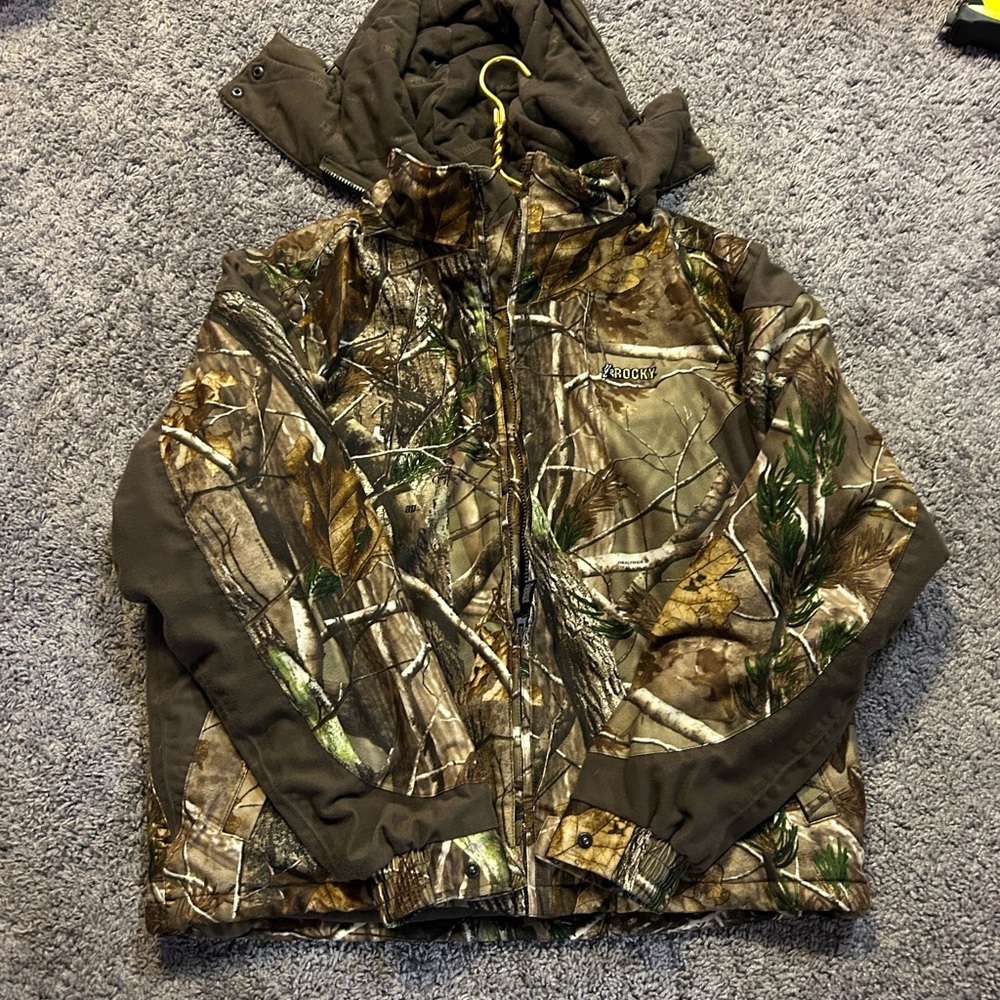Rocky camouflage hunting jacket. Clean like new.  Realtree pattern.